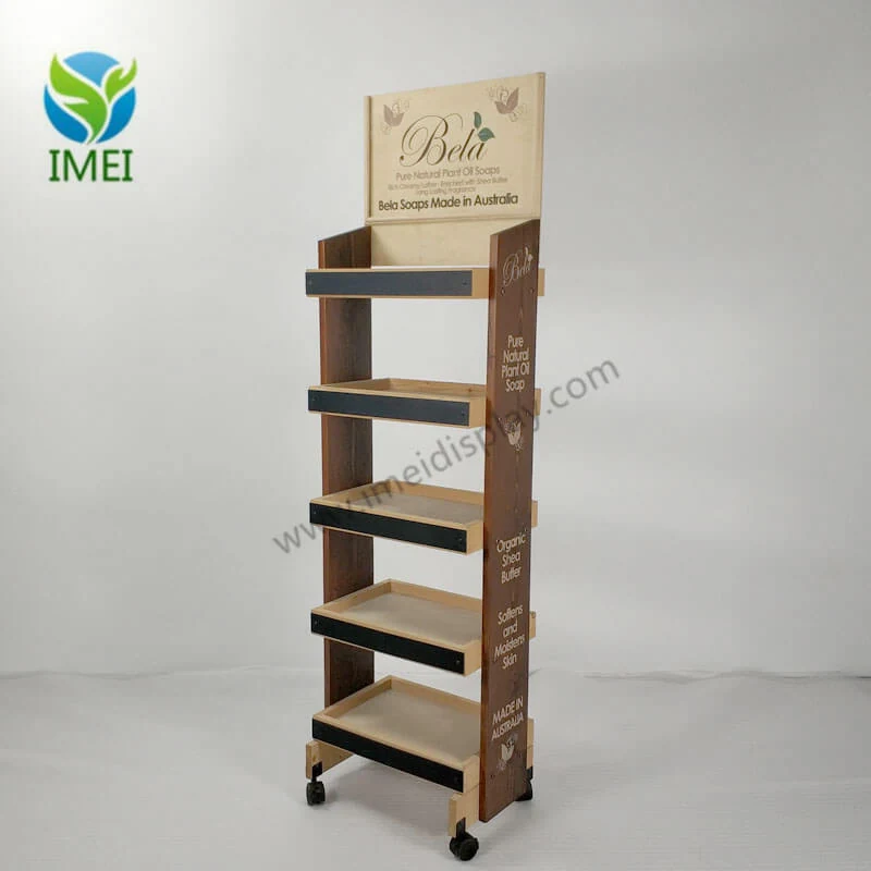 Wooden five-shelf floor display standing upright in a retail workshop