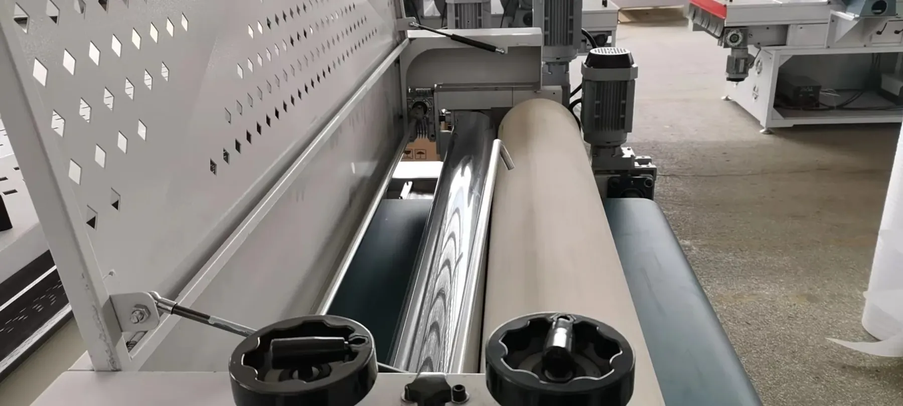 Close view of the coating roller and doctor roller inside an INCRI roller coater