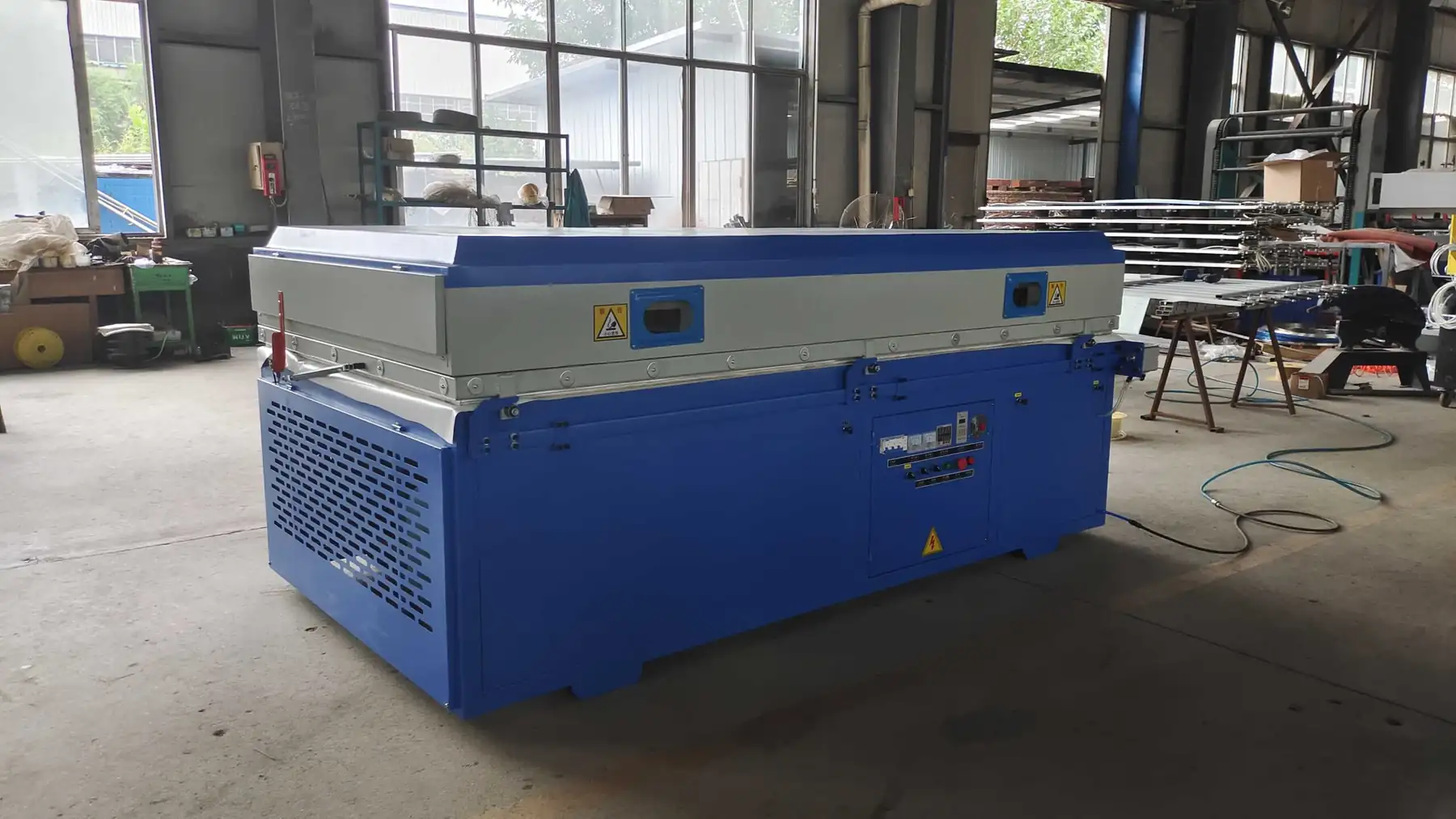 Vacuum Membrane Press Machine for PVC Film Cabinet Door, front view on the assembly floor