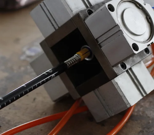 Flick lock mechanisms being installed on aluminium pole shafts