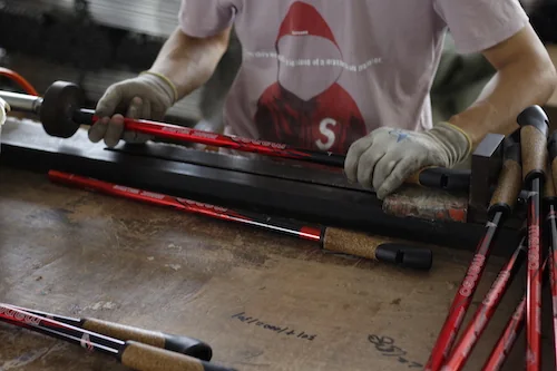 Plastic parts being fitted to pole assemblies