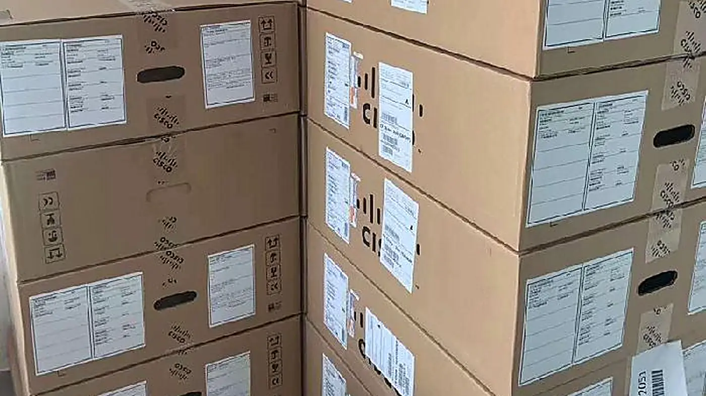 Sealed Cisco cartons racked in the Hong Kong warehouse