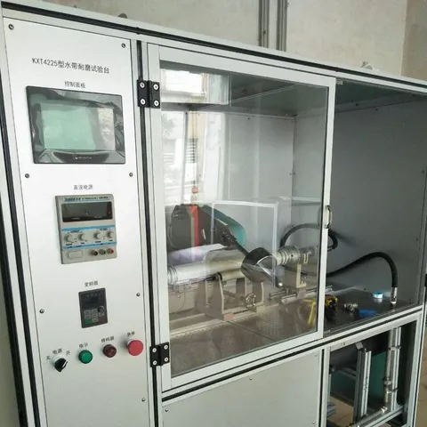 Abrasion tester. Cover wear is the main life limit on hose that is dragged and reeled.