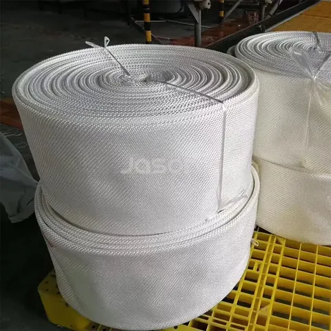 Canvas discharge hose rolled flat for transport