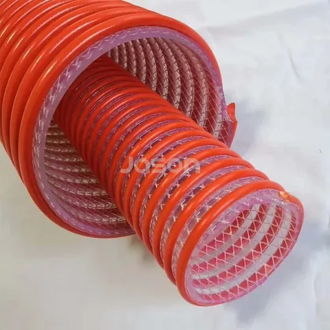 Fabric reinforced suction hose wall showing helix and polyester layer