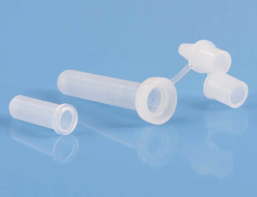 Clear molded part photographed against a plain ground