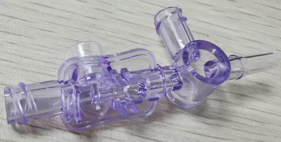 Clear molded connector part with side ports
