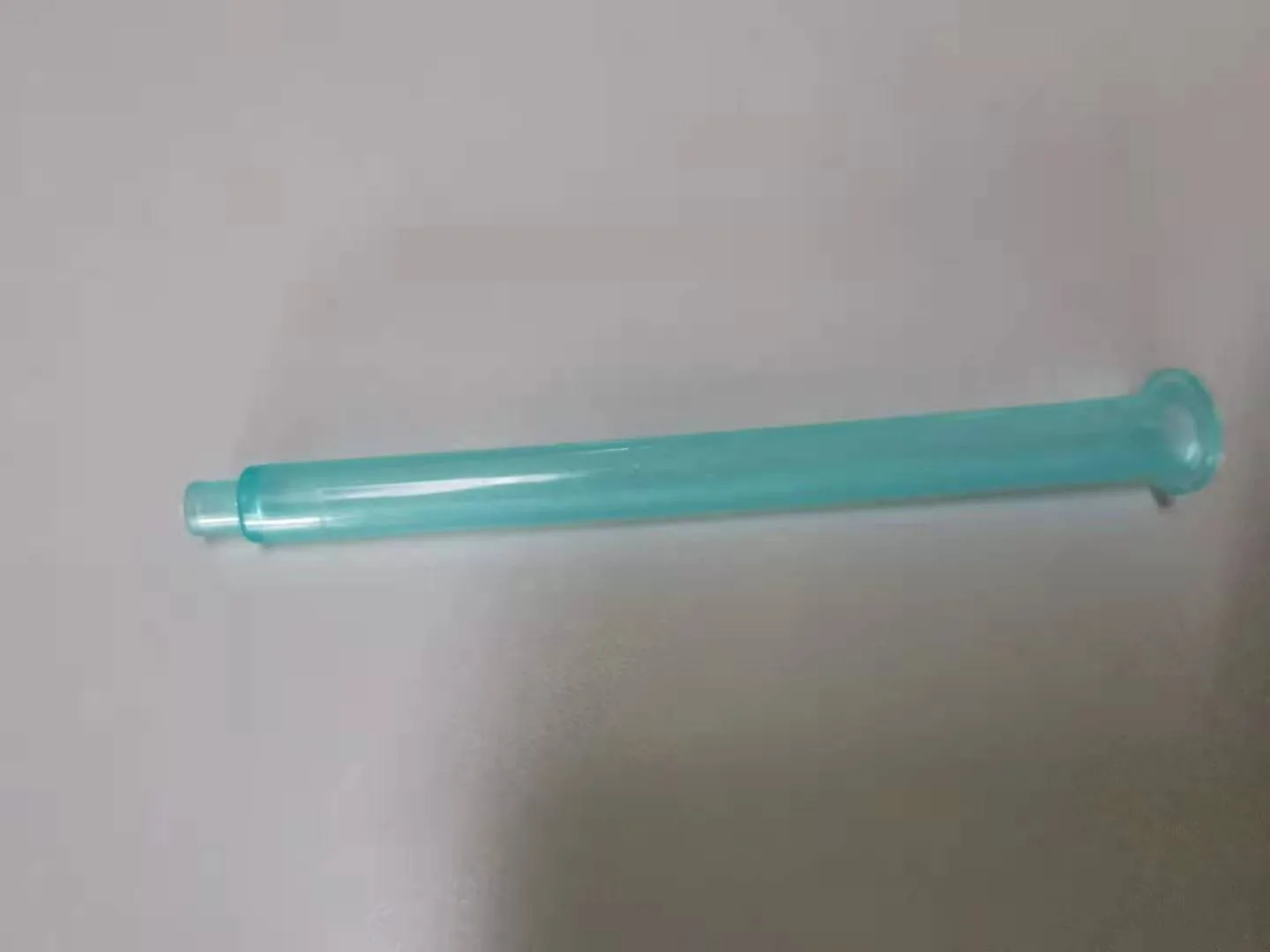 Clear molded tube component on the inspection bench