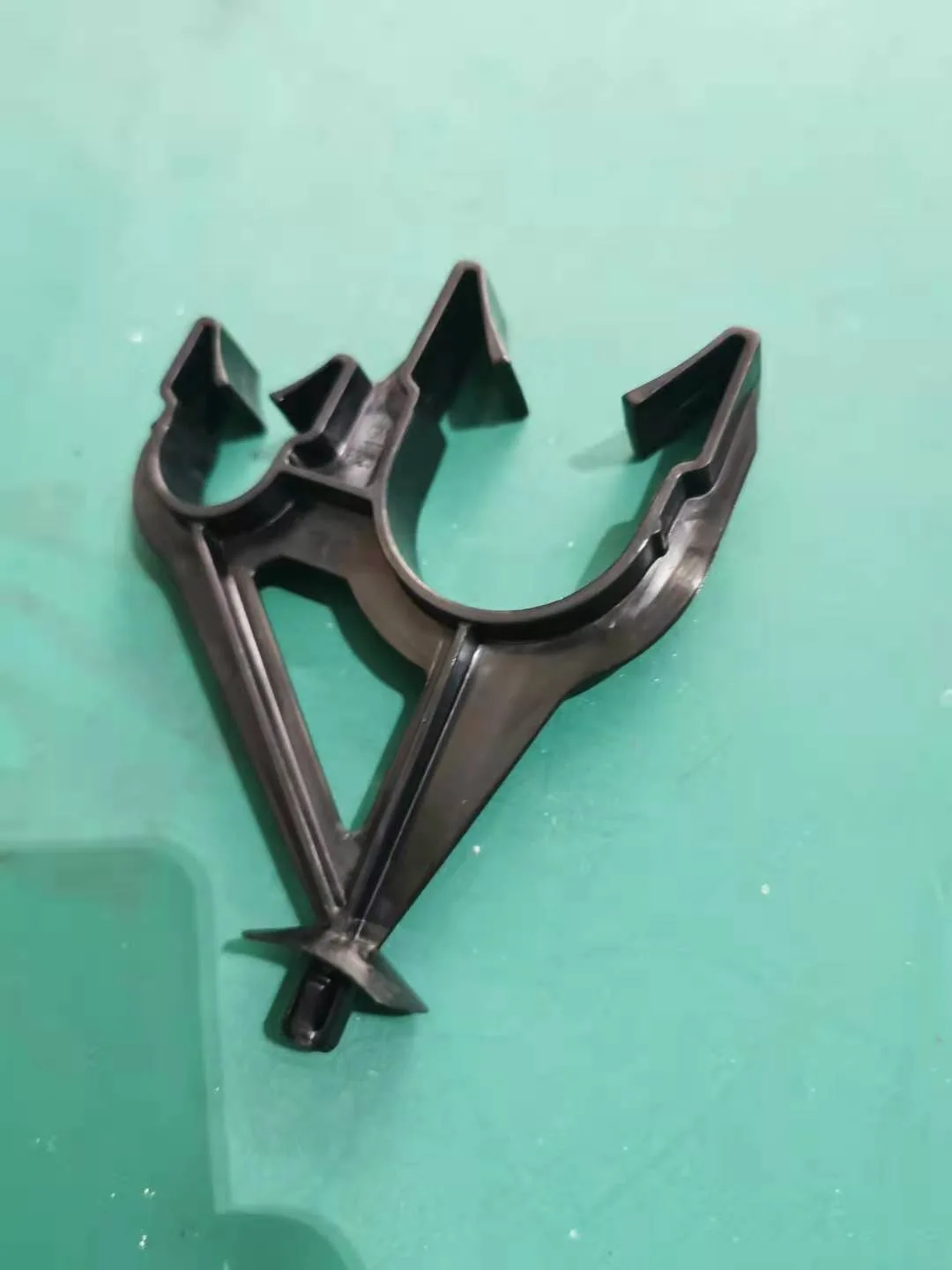 Black molded structural part on the shop bench