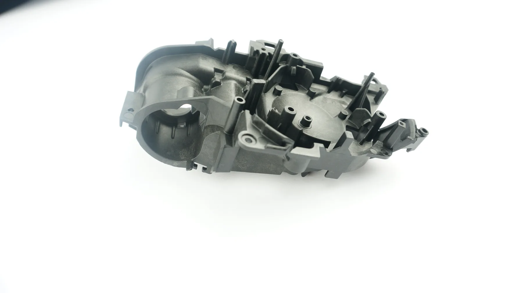 Black molded frame part in the tool shop