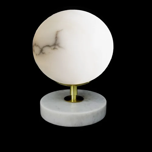 B06 Moon alabaster table lamp photographed lit against a black background
