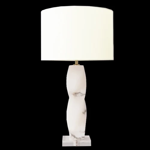 B08 Flowing alabaster table lamp photographed lit against a black background