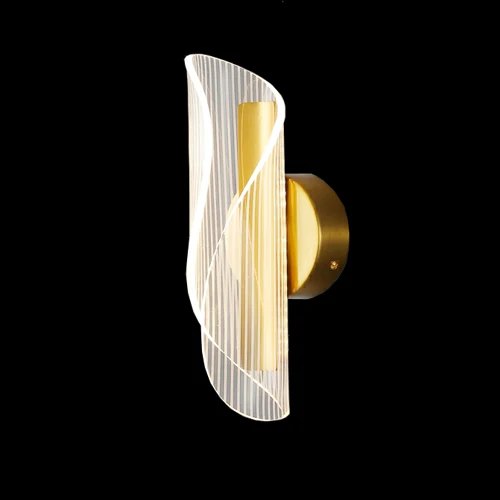 C02 Shell wall sconce photographed lit against a black background