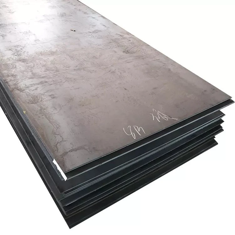 Stack of dark steel plates with white chalk markings on top sheet, isolated on white