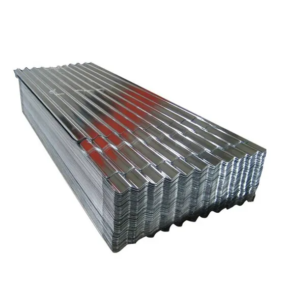 Stack of shiny corrugated galvanized steel sheets on a plain white background