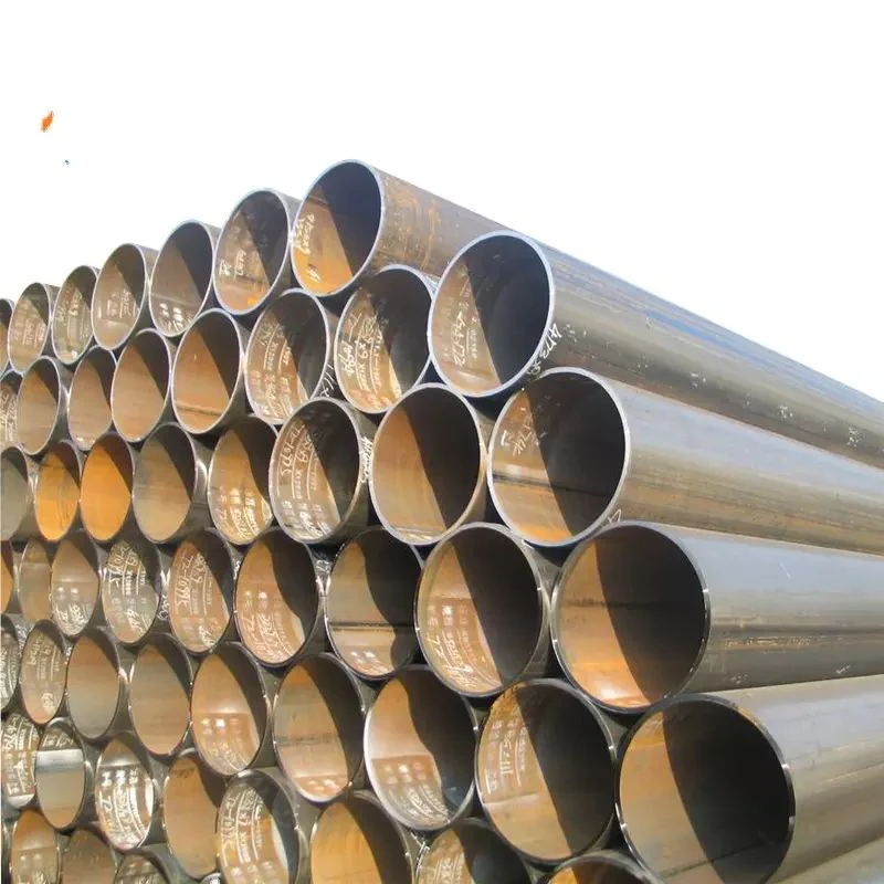 Stacked steel pipes viewed end-on, showing dark metal interiors with stenciled markings, on a white background