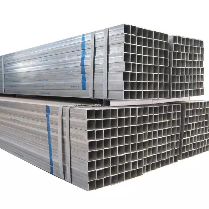 Stacked bundles of galvanized square steel tubing secured with blue and steel strapping on a plain white background