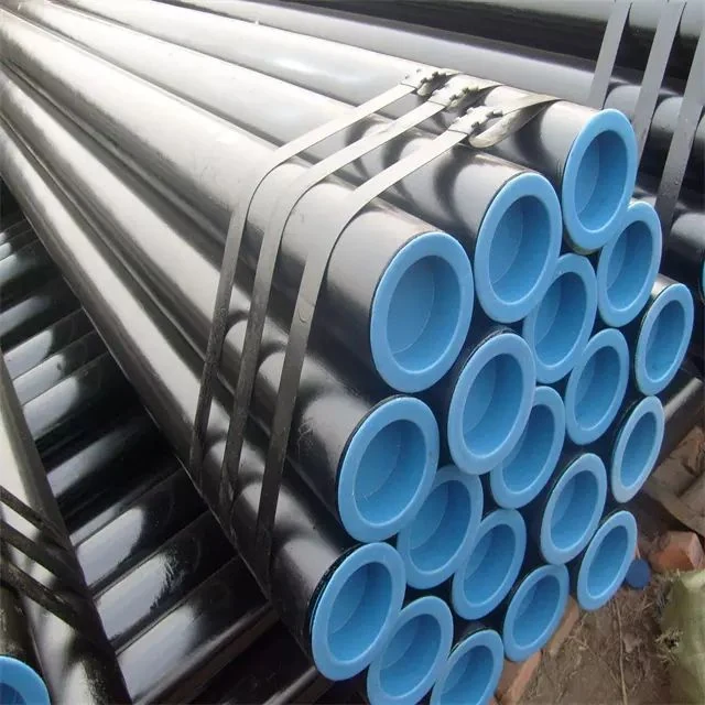 Bundled black steel pipes with blue plastic end caps, secured together with metal strapping bands