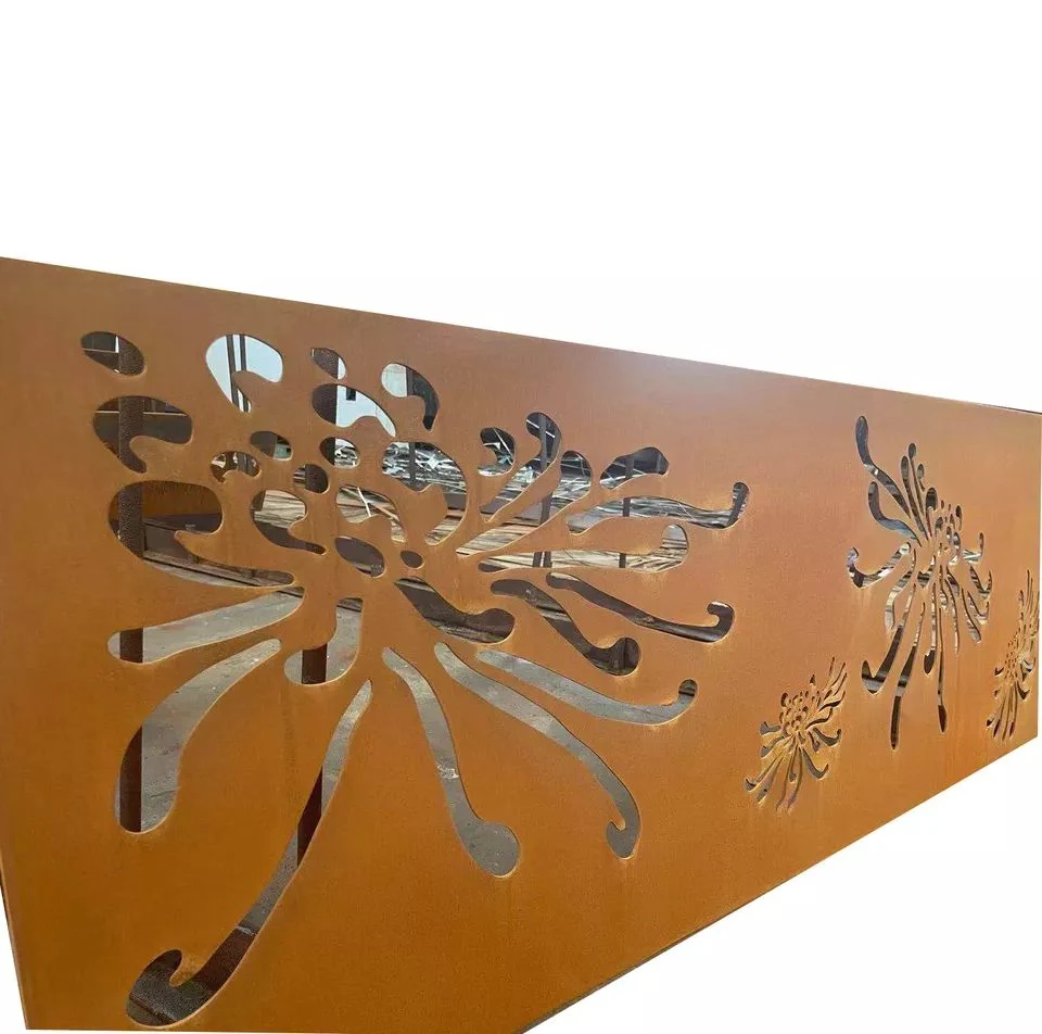 Laser-cut corten steel decorative panel with chrysanthemum floral pattern, workshop visible through cutouts