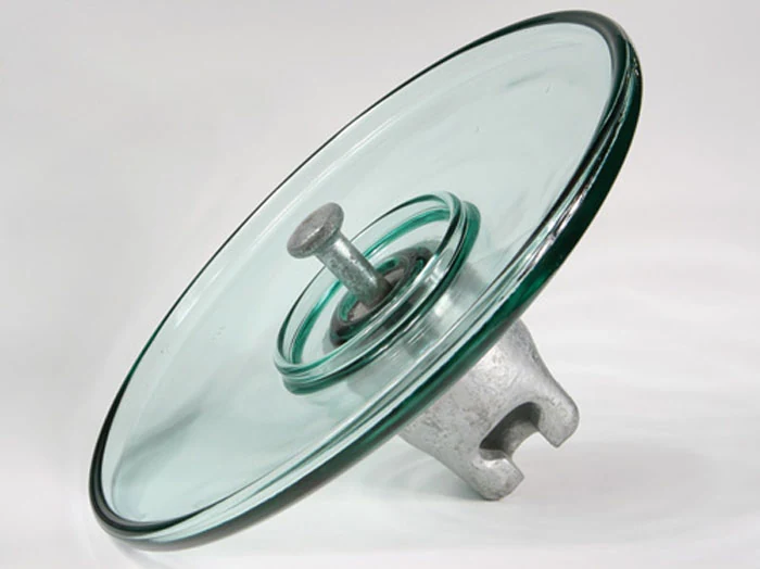 Aerodynamic profile toughened glass insulator with wide flat open shed for desert conditions