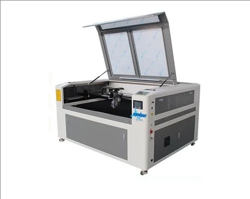 Hybrid laser cutter cutting acrylic panel in advertising workshop