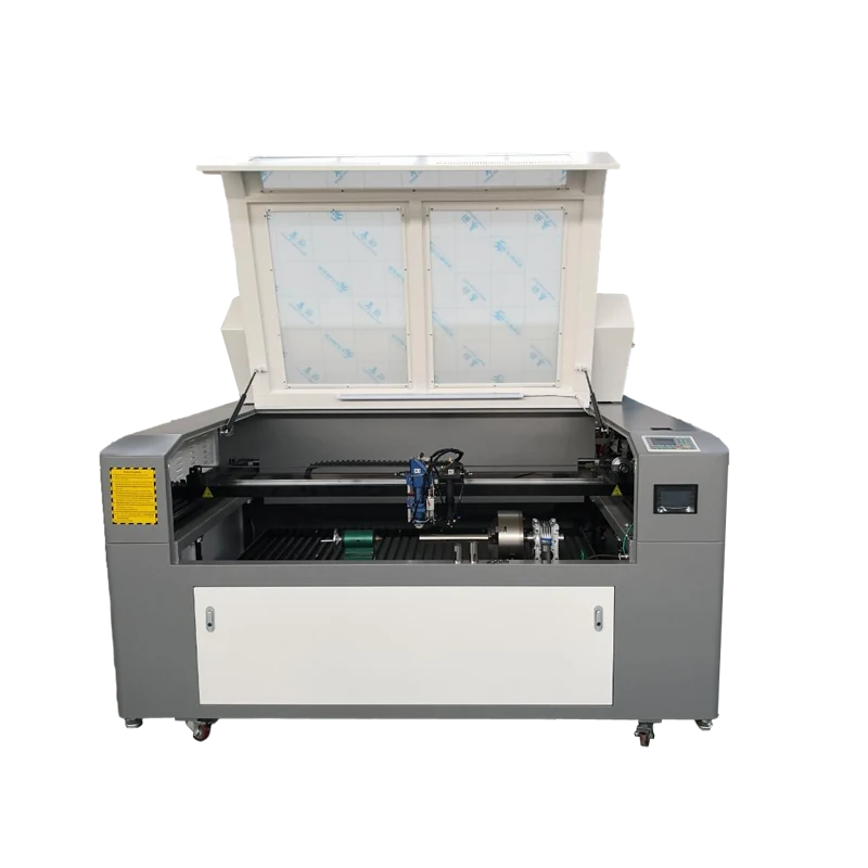 CO2 laser cutter processing round metal tubes on rotary axis