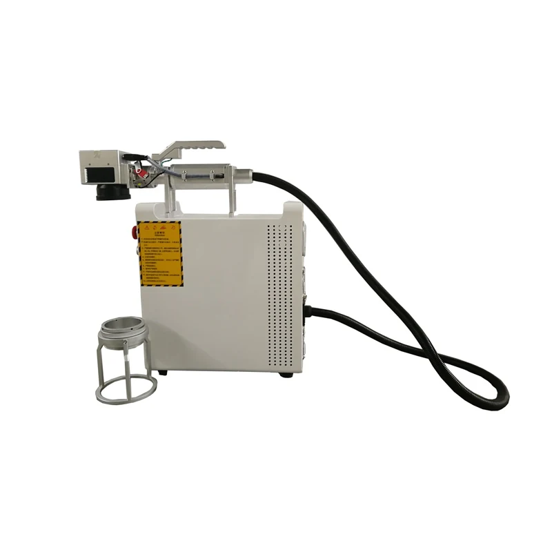 Operator using handheld laser marking machine on a metal part