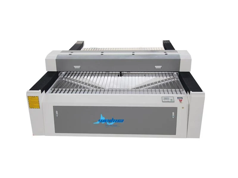 CO2 laser cutter cutting wood sheet in workshop