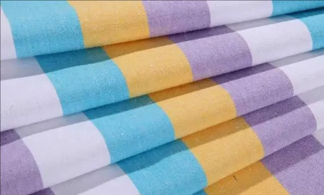 Printed fabric being cut on a large-format laser bed