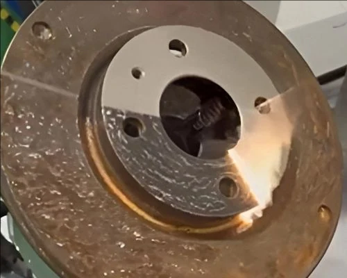 Laser cleaning a metal surface in the workshop
