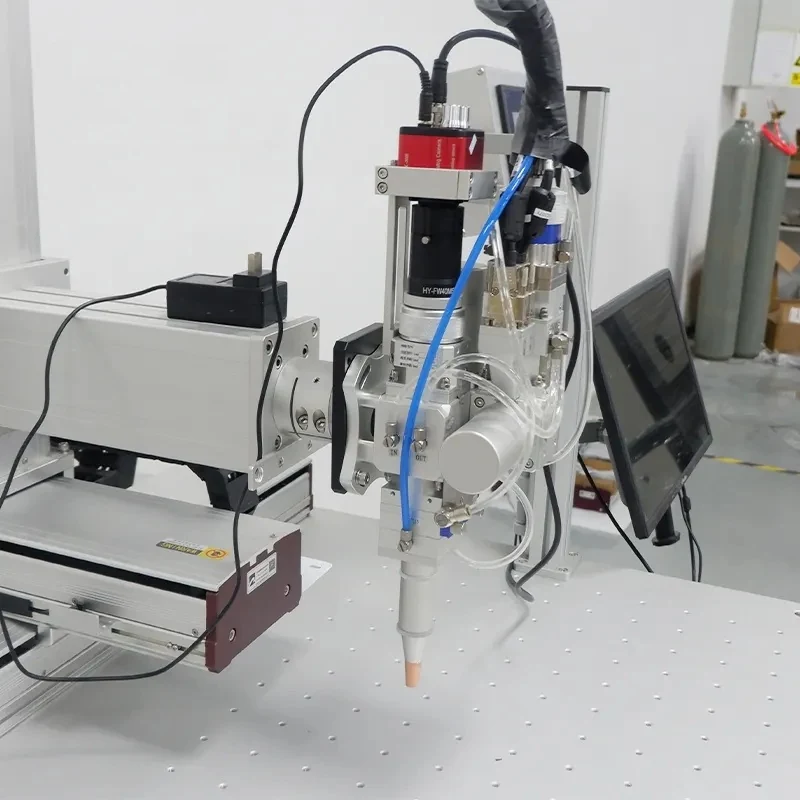 Laser welder showing red light pointer and welding head
