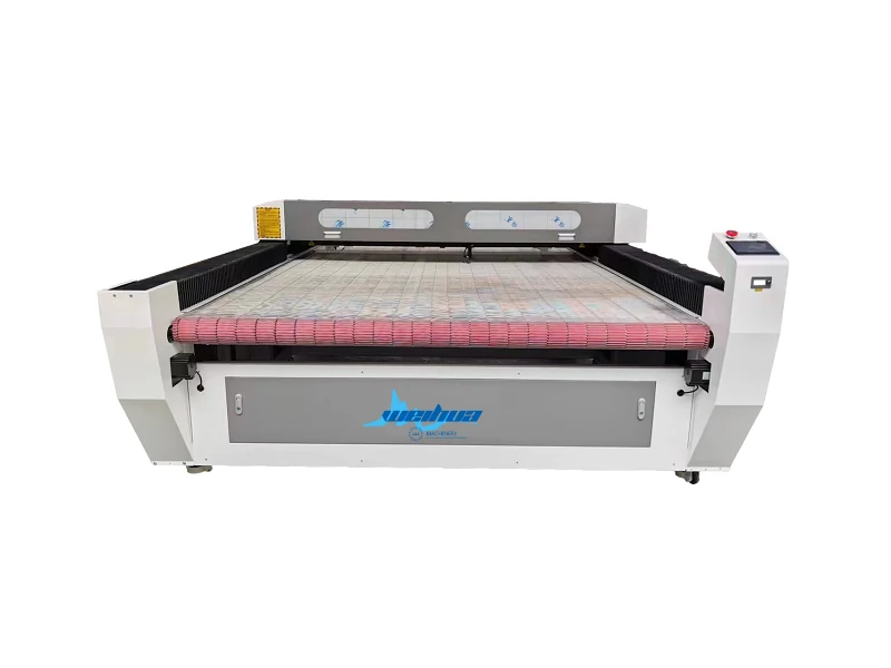 Cutting fabric with laser cutter showing the mesh belt platform