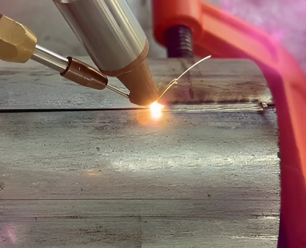 Handheld laser welding a stainless steel joint in the Weihua Laser workshop