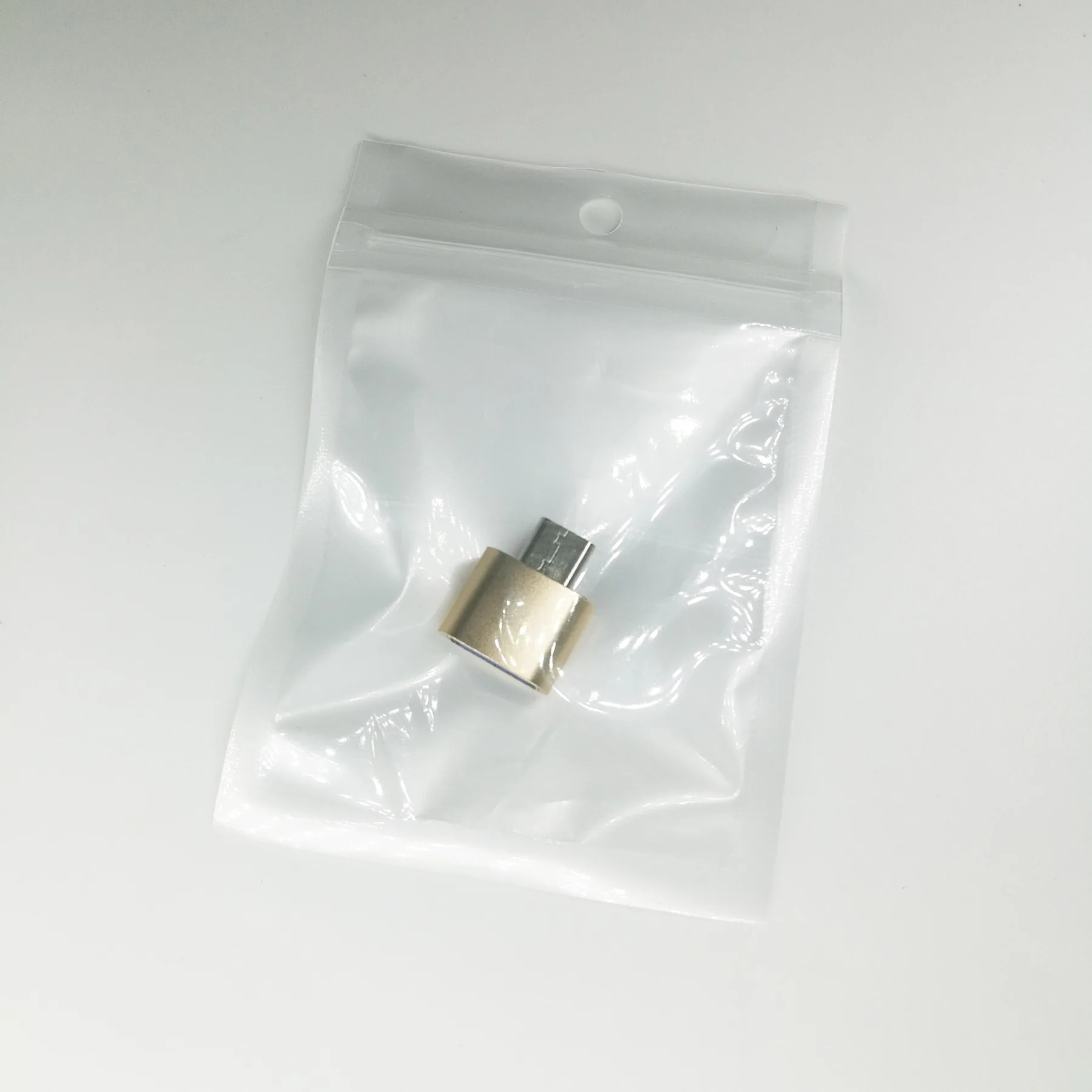 USB-A Female To USB-C Male OTG Adapter, shown in use