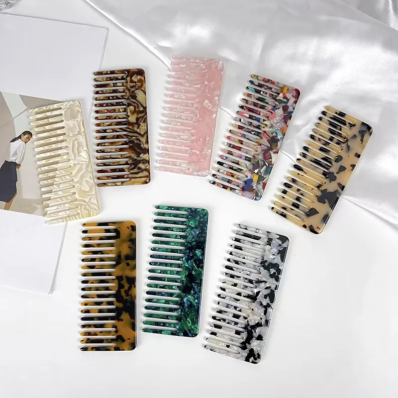 Cellulos acetate wide teeth comb with rounded tips laid flat