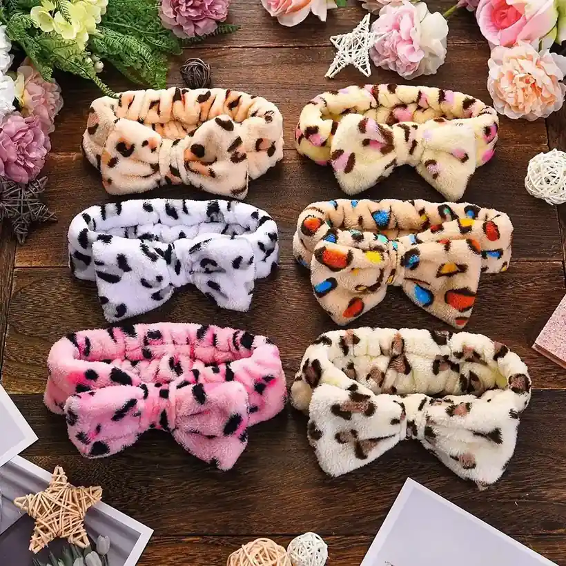 Six coral fleece spa headbands with bow detail in leopard and floral prints