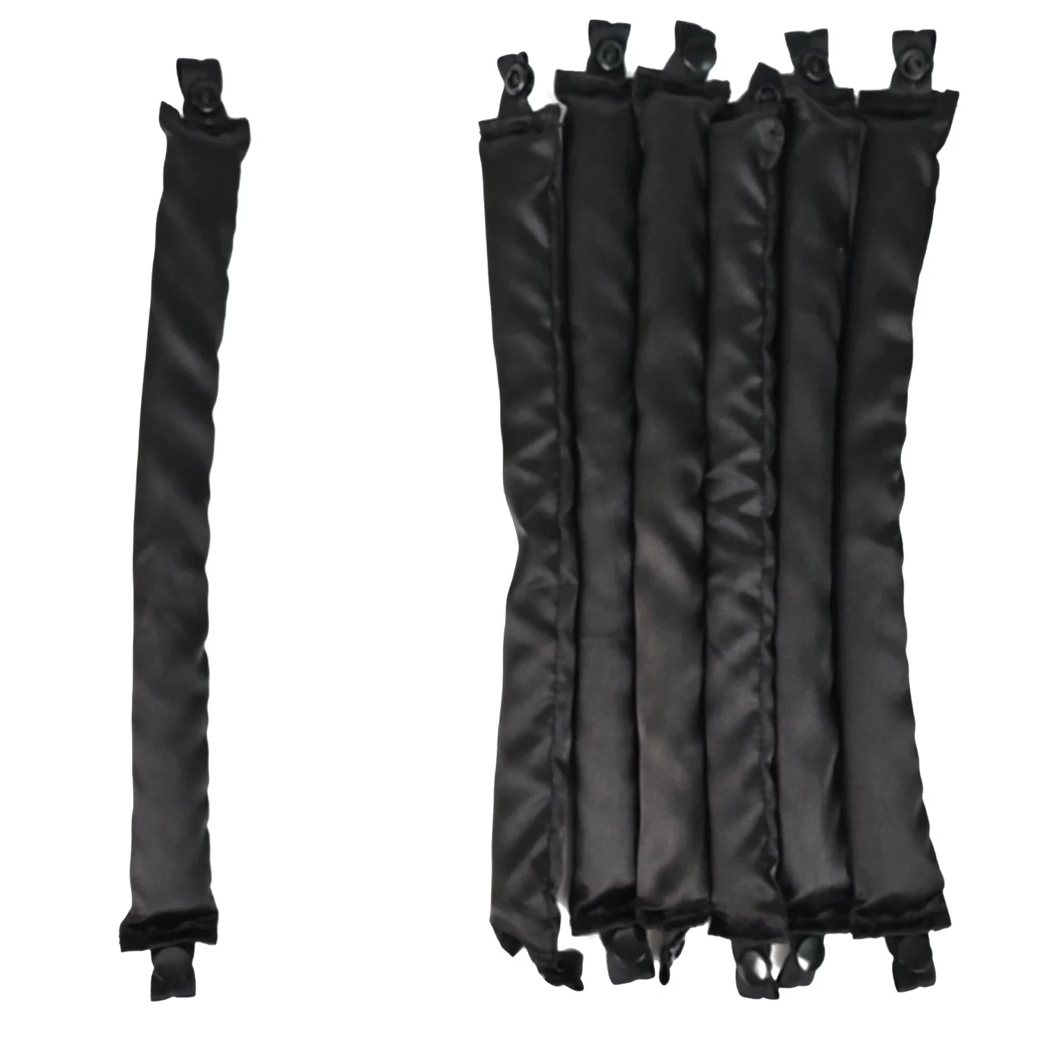 Set of six satin covered heatless hair curler rods laid out flat