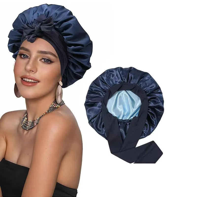 Satin double layer hair bonnet laid out flat showing the double-layer construction and elastic tie bands