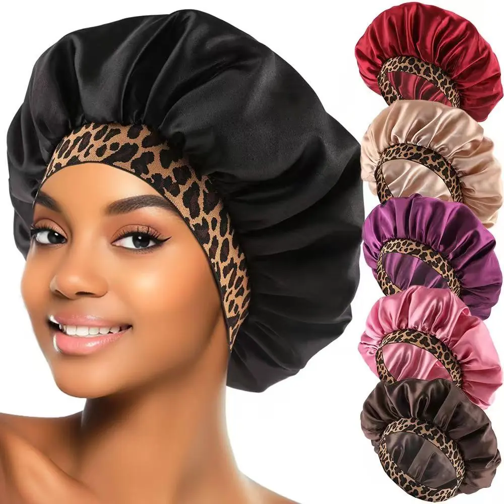 Satin hair bonnet with leopard pattern and wide elastic band laid flat