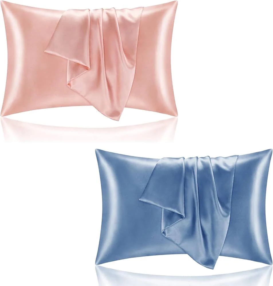 Silk or satin pillowcase laid flat, showing the smooth surface and hand-stitched edges