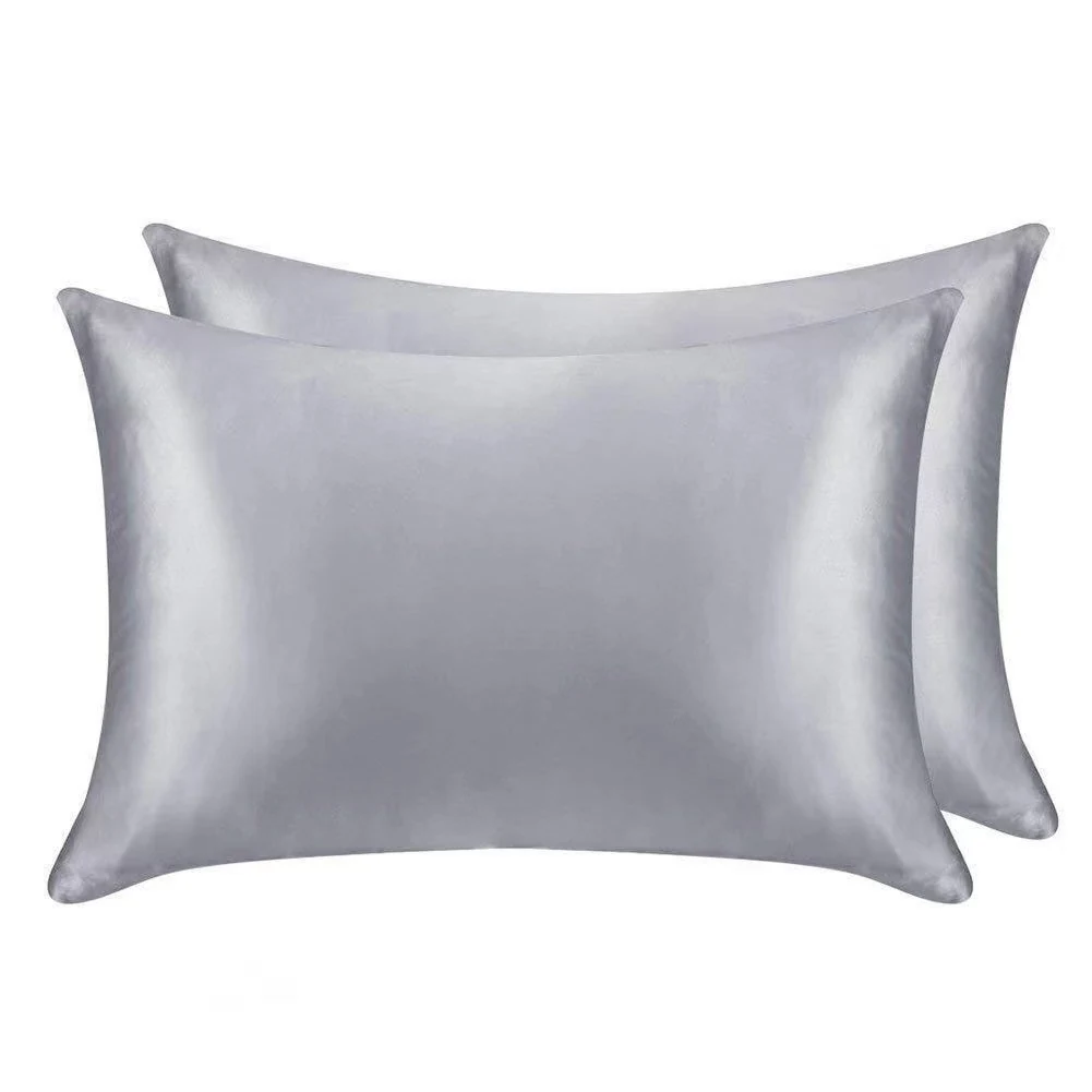 Satin pillowcase with full-length zipper laid flat, showing the glossy smooth surface