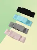 Black sport headband laid flat showing seamless front and flatlock stitching