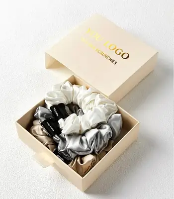 Silk scrunchie wrapped around a small section of hair, demonstrating low tension and no marks