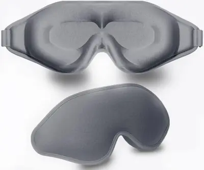 Silk eye mask worn on a face, demonstrating the zero-pressure fit and light blockout
