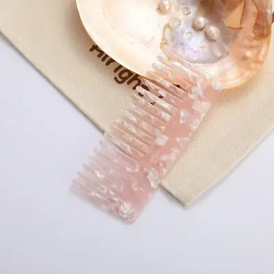 Comb held in hand showing the smooth, non-slip grip