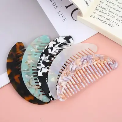Close-up of the rounded teeth and arch shape on the hair comb