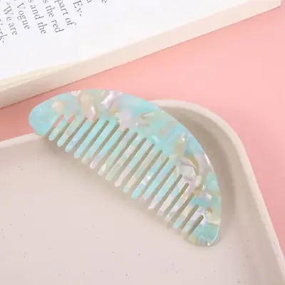 Combs packed in a custom polybag with brand label and barcode