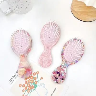 Close-up of the smooth, crystal-like surface of the brush handle