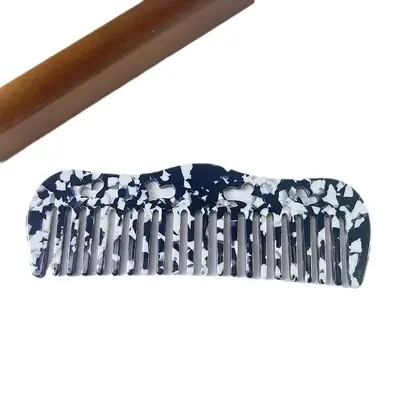 Comb in use on wet hair, gently detangling without pulling