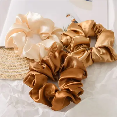 Microfiber scrunchie worn on a ponytail, showing the soft fabric and secure fit